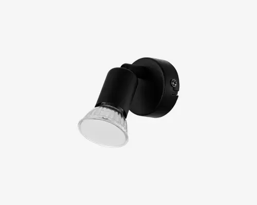 Justerbar vægmonteret spotlampe med en mat sort cylindrisk lampehus og en klar, rillet glasdiffusor foran. Lampen har en rund base for sikker montering og en synlig skrue for nem installation. Spotlampens hoved kan vinkles, så lyset kan rettes efter behov, hvilket gør den velegnet til accent- eller arbejdsbelysning.