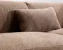 Nærbillede af en beige-brun polstret overflade med en matchende rektangulær pude, der viser et blødt vævet stof og en neutral farvetone.