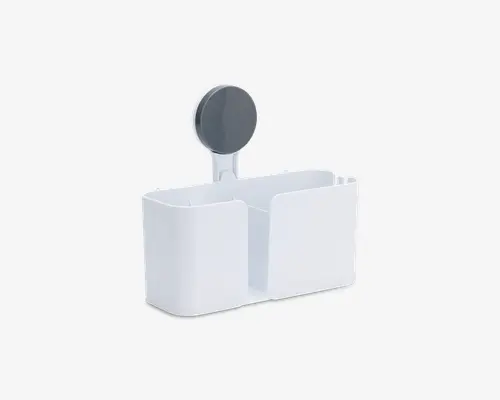Rektangulær hvid plastikorganizer med to rum i forskellige størrelser. Den har en rund, mørkegrå sugekop bagpå, så den nemt kan fastgøres til glatte overflader som fliser eller glas. Kanterne er afrundede for et moderne udseende, og rummene er åbne foroven for nem adgang.