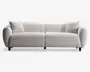 Moderne sofa med minimalistisk design og blødt, tekstureret lysebeige betræk. Sofaen har brede, afrundede armlæn og lav ryg, hvilket giver et hyggeligt og indbydende udtryk. Der medfølger to matchende, firkantede puder, én i hver ende. Sæde- og ryghynderne er tykke og bløde for ekstra komfort. Sofaen står på korte, næsten usynlige ben, hvilket giver et svævende udseende.
