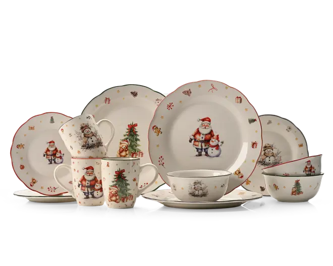 Festligt hvidt stel med rød kant på tallerkener, kopper og skåle, dekoreret med julemand, snemænd, juletræer og små julemotiver i et matchende vinterdesign.