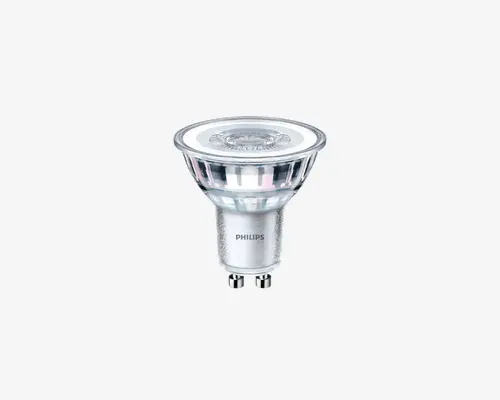 LED-spotpære med klart glaslegeme og GU10-fatning. Pæren har en bred, flad top med et matteret center, der giver et blødt og diffust lys. Den metalliske sokkel er mærket med mærket 'Philips'. Designet er kompakt og moderne, velegnet til indbygnings- eller skinnesystemer.