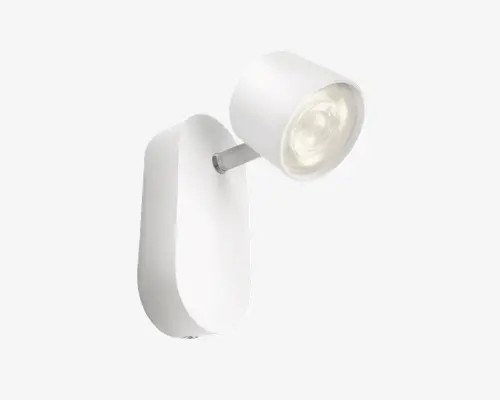 Moderne vægmonteret spotlampe med en elegant, mat hvid finish. Lampen har et cylindrisk, justerbart hoved, der er fastgjort til en oval base, hvilket giver mulighed for retningsbestemt belysning. Designet er minimalistisk og moderne, velegnet til accent- eller arbejdsbelysning i forskellige indretninger.