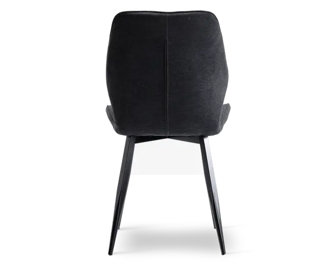 Billedet viser bagsiden af en stol med mørkt polstret ryglæn. Stolen har en lodret syning ned langs midten af ryglænet og slanke, skråtstillede metalben, der giver et moderne og robust udtryk.
