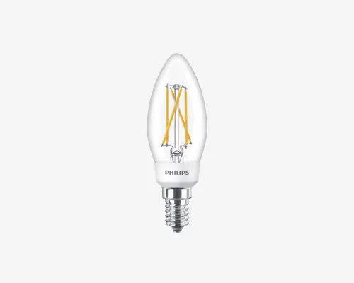 Klar glas LED-pære med stearinlysform, synlige gule filamentstrimler indeni for et vintage udseende. Soklen er en lille skruefatning (E14), og mærket 'Philips' er trykt på den hvide krave over metalskruen. Pæren er designet til dekorativ belysning og giver energieffektiv ydeevne.