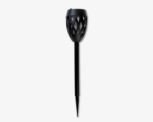 Elegant sort udendørs fakel med cylindrisk krop og hoved med gittermønster. Den øverste del har et krydsmønster, der lader lyset skinne igennem, mens den lange, glatte pind er designet til nem nedstikning i jorden. Det samlede udtryk er moderne og minimalistisk, velegnet til nutidige udendørs omgivelser.