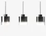 Sæt med tre pendellamper med firkantede, klare glasskærme, der har en gradient fra gennemsigtig i toppen til mat hvid i bunden. Hver lampe har en sort metalfatning og sort ledning til ophæng. Pærerne er synlige gennem glasset, hvilket giver et moderne og minimalistisk udtryk.