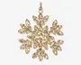 Guldfarvet ornament formet som en snefnug, dekoreret med mange marquise-slebne, klare krystaller arrangeret i et symmetrisk mønster. Krystallerne sidder i en ramme af guldmetal, hvilket giver et funklende og elegant udtryk. Ornamentet har en lille løkke foroven med en guldfarvet snor til ophæng.