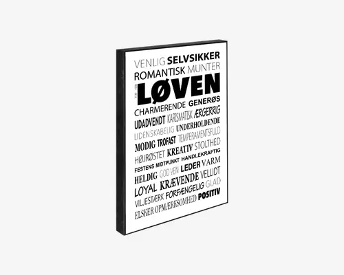 En indrammet plakat med hvid baggrund, der viser en række danske ord i forskellige skrifttyper og størrelser, arrangeret på en visuelt interessant måde. Det største og mest markante ord i midten er "LØVEN", omgivet af beskrivende ord og egenskaber som "selvsikker", "romantisk", "kreativ" og "positiv". Teksten er udelukkende sort, og rammen er smal og sort, hvilket giver plakaten et moderne og minimalistisk udtryk.