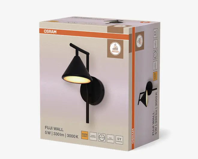 Produktæsken viser en moderne væglampe med mat sort finish. Lampen har en konisk skærm, der hænger fra en lodret stang, som er fastgjort til en rund vægplade. På æsken fremhæves vigtige egenskaber: 5 watt strømforbrug, 330 lumen lysstyrke og en varm hvid farvetemperatur på 3000K. Emballagen angiver også 5 års garanti og egnethed til indendørs brug.