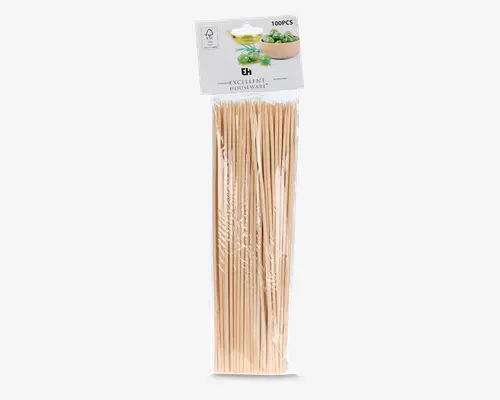 En klar plastikpakke indeholdende 100 lange, tynde træspyd. Spyddene er lyse beige, lige og har spidse ender, der gør det nemt at stikke dem gennem mad. Emballagen har en etiket øverst med et billede af mad og mærket 'Excellent Houseware.' Spyddene er pænt bundtet sammen inde i pakken.