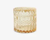 Rund glasbeholder med tilhørende låg, dekoreret med et tekstureret, diamantmønstret design på sider og top. Glasset har en varm ravfarvet tone, hvilket giver det et vintage eller elegant udseende. Beholderen er robust og dekorativ, velegnet til opbevaring af småting eller som pyntegenstand.