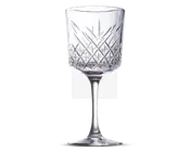 Klar glas med en høj, slank stilk og en bred, cylindrisk skål. Skålen har et indviklet slebet mønster med diamant- og lodrette linjer, hvilket giver et klassisk og elegant udseende. Randen er glat og let afrundet, og bunden er flad og stabil.