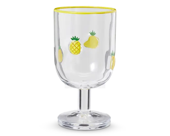 Klar glasbæger med kort, solid stilk og bred fod. Glassets skål er dekoreret med små, farverige illustrationer af ananas og mango, og kanten er fremhævet med en lys gul stribe.