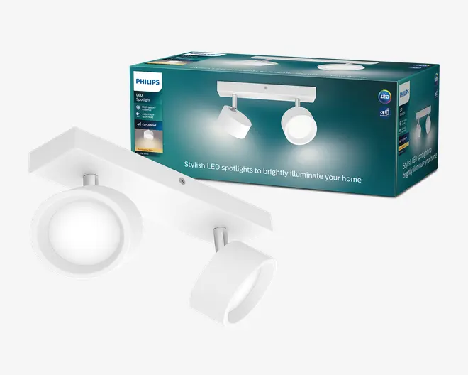 Hvid Philips LED-spotlampe med rektangulær base og to justerbare runde spot-hoveder, vist sammen med den turkise emballage.