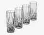 Sæt med fire høje, klare glas med facetslebet diamantmønster i bunden, som gradvist går over i en glat overflade mod kanten. Glassene har en cylindrisk form og en tyk, solid bund, hvilket giver dem et elegant og klassisk udseende.