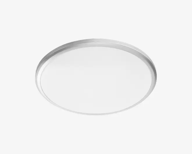 Et rundt, fladt fad med en glat, let forhøjet kant. Fadet har et enkelt og minimalistisk design og ser ud til at være lavet af metal med en mat overflade. Overfladen er ensfarvet og uden dekoration, velegnet til servering eller transport af genstande.