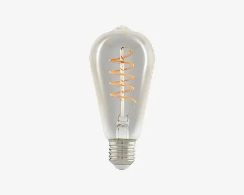 Klar glaspære med en vintage-inspireret, aflang dråbeform. Synlig spiralformet glødetråd giver et dekorativt, retro udtryk. Standard skruefatning for nem montering. Velegnet til lamper, hvor pæren er synlig, eller som dekorationsbelysning.