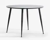 Rundt bord med en glat, flad overflade og fire slanke, tilspidsede metalben. Bordpladen har et minimalistisk design med en tynd profil, og benene er vinklet udad for stabilitet. Finishen er mat, hvilket giver bordet et moderne og stilrent udseende.