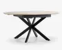 Et moderne bord med en lys, rund bordplade med glat overflade. Bordets ben er lavet af sort metal og er arrangeret i et markant krydset stjernemønster, hvilket giver både stabilitet og et moderne udtryk.