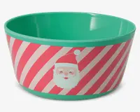 En rund skål med turkis inderside og kant. Ydersiden har et festligt design med diagonale lyserøde og hvide striber samt et tegnet julemandsansigt med rød hue. Skålen har en glat overflade og et muntert juletema.
