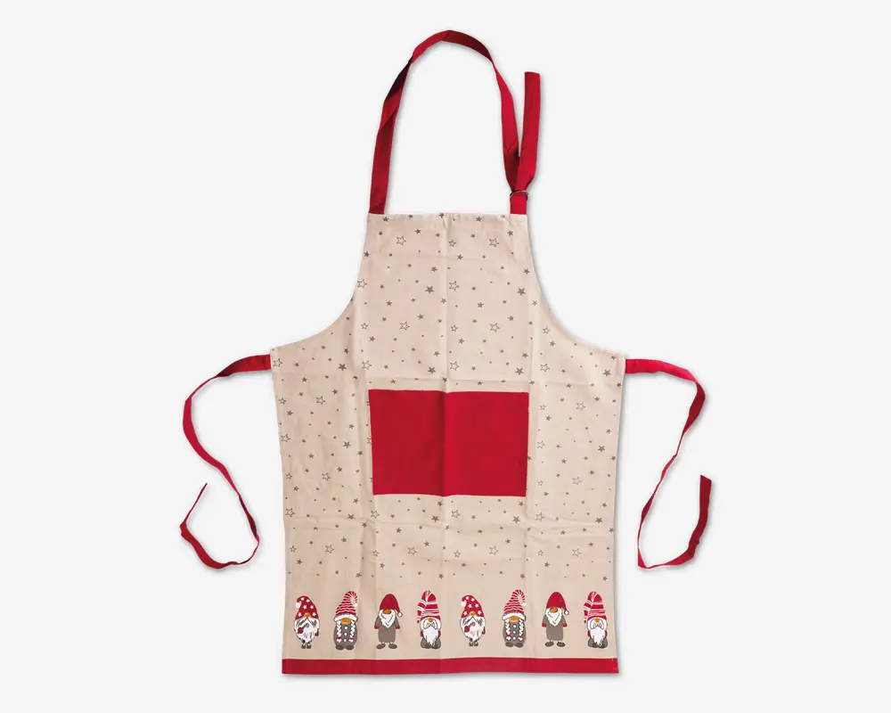 Beige forklæde med et festligt design, der har små grå stjerner spredt over stoffet. Forklædet har en stor rød lomme foran samt matchende røde bånd til nakke og talje. Langs den nederste kant er der en række sjove nissefigurer med røde og hvide huer, som giver et hyggeligt julet præg.