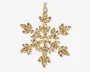 Guldfarvet ornament formet som en snefnug, dekoreret med mange facetslebne, marquise-formede krystaller arrangeret i et symmetrisk mønster. Krystallerne er indfattet i en metalramme, hvilket giver et funklende og elegant udtryk. Ornamentet har en lille løkke øverst til ophængning.