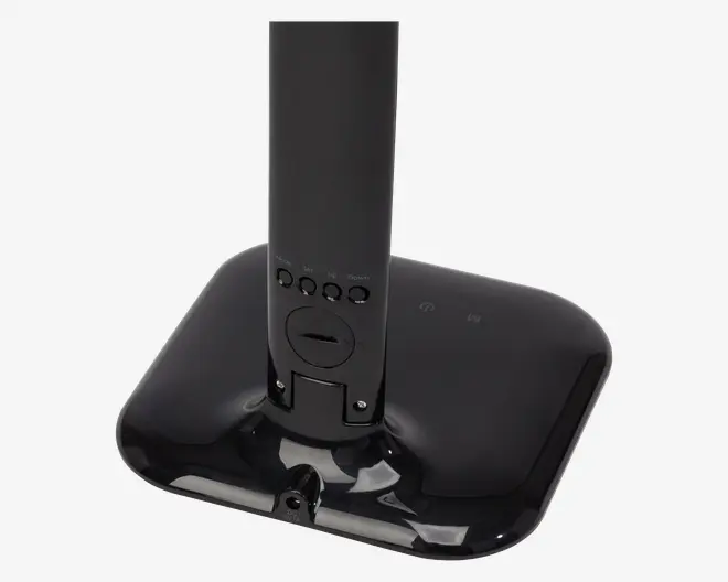 En blank sort rektangulær base med afrundede hjørner, der har en lodret støttekolonne i midten. Kolonnen har fire knapper mærket 'Timer', 'Up' og 'Down' samt en cirkulær drejeknap under knapperne. Basen har to berøringsfølsomme ikoner, sandsynligvis til strøm og tilstand. Det samlede design er stilrent og moderne med en glat, reflekterende overflade.