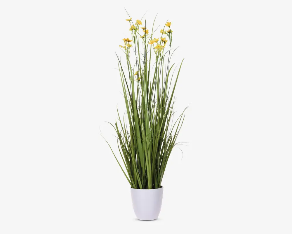 Høj kunstig plante med lange, slanke grønne stængler og små gule blomster, arrangeret i en enkel hvid potte. Planten har et naturligt, opretstående udseende og er velegnet til indendørs dekoration.