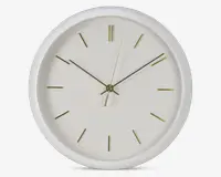 Rund vægur med hvid ramme og urskive, udstyret med minimalistiske guldfarvede time-markeringer og slanke guldfarvede visere til timer, minutter og sekunder. Designet er enkelt og moderne uden tal eller ekstra dekorationer.