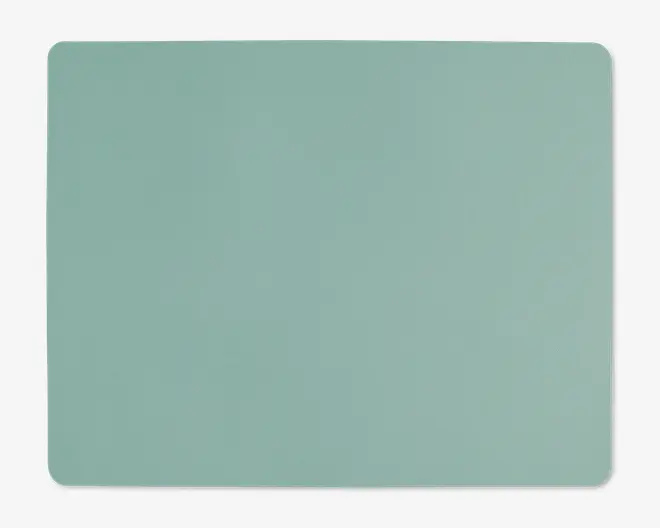 Et rektangulært underlag med afrundede hjørner og en glat, ensfarvet lysegrøn overflade. Kanterne er pænt afsluttede, og underlaget har et minimalistisk design uden synlige mønstre eller teksturer.