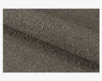 Nærbillede af et tekstiler med en tæt vævet, løkket overflade i en dæmpet brungrå farve, som giver et blødt og nubret udtryk. Materialet ser tykt og slidstærkt ud, velegnet til polstring eller kraftig brug.