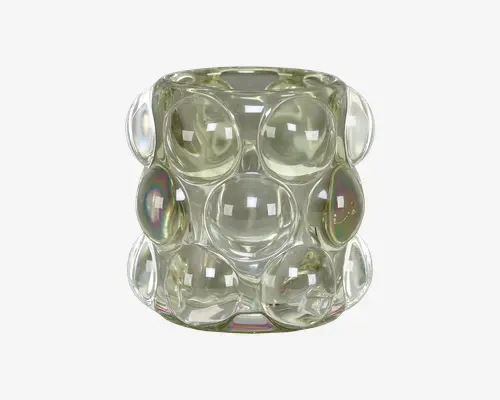 Et klart glasobjekt med cylindrisk form, der har en overflade med store, buede boblelignende forhøjninger arrangeret i et gittermønster. Glasset har en let iriserende finish, som reflekterer lyset og skaber diskrete regnbueeffekter på nogle af boblerne. Udseendet er moderne og dekorativt.