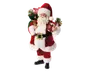 Figur iført traditionelt rødt og hvidt julemandskostume med blød pelskant på jakke, bukser og hue. Figuren har et sort bælte med stort guldfarvet spænde, sorte støvler og krøllet hvidt skæg. I den ene hånd holder den en grøn sæk fyldt med julegrønt, slikstokke og gaver. I den anden hånd bærer den en rød gaveæske pyntet med guldbånd og kunstige grangrene. Udseendet er festligt og detaljeret, velegnet som julepynt.