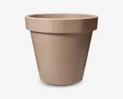 En enkel, rund, lysebrun beholder med en bred kant øverst. Overfladen er glat og mat, og beholderen bliver smallere mod bunden. Designet er minimalistisk uden synlige mønstre eller dekorationer.