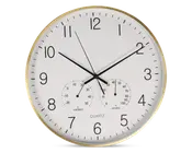 Rund vægur med hvid urskive, sorte time- og minutvisere samt en tynd sort sekundviser. Store sorte arabiske tal markerer hver time, og der er minutmarkeringer langs kanten. Uret har også to små målere nederst: én til temperatur (termometer) i grader Celsius og én til luftfugtighed (hygrometer) i procent. Rammen er i metallisk guld.