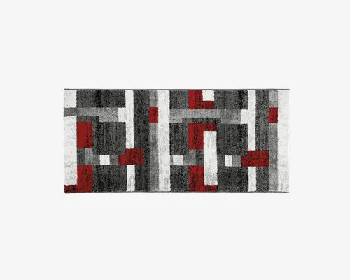 Rektangulært tæppe med et moderne geometrisk mønster bestående af blokke og linjer i sort, grå, hvid og rød. Designet er symmetrisk med en blanding af store og små rektangler og firkanter, hvilket giver et markant, nutidigt udtryk. Overfladen ser blød og tekstureret ud.